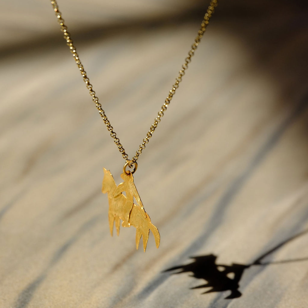 Après Ski gold plated silver necklace with man riding horse charm. delicate necklace with hanger cruba