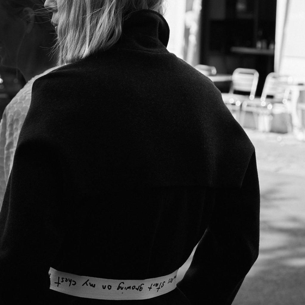 Model wearing a trench coat / merino wool & cashmere coat with canvas belt. Layering outfit. cruba.