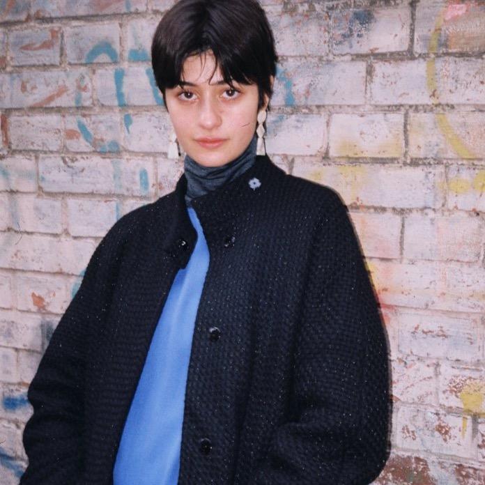 black canvas-weave sparkling effect coat with kimono sleeves, cashmere wool, snap closures. cruba