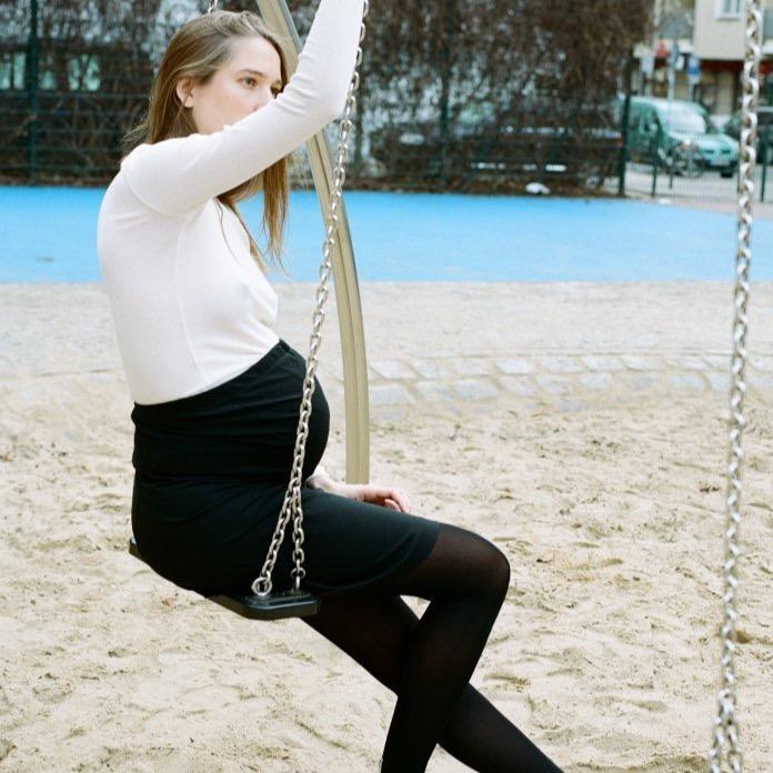 Black maternity pencil skirt with curved seam details and back support. pregnancy skirts. free shipping. locally produced, German fashion / clothing label. cruba  Edit alt text